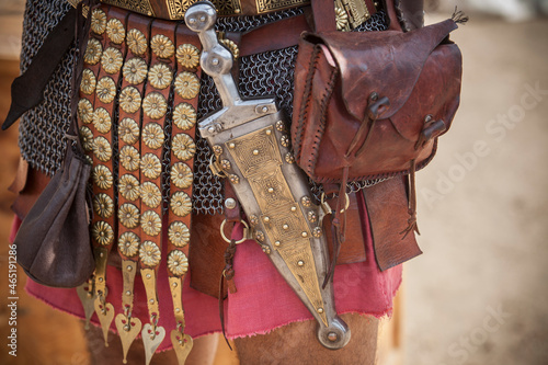 Centurion girding a pugio, a dagger used by roman soldiers as a sidearm