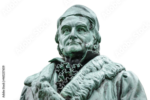 Historic statue of Carl Friedrich Gauss at his birthplace in Braunschweig, Lower Saxony, Germany. Portrait of famous mathematician and physicist (1777-1855), isolated on white background.