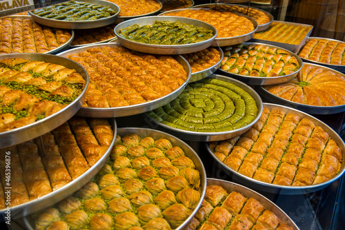 Baklava varieties on dessert store. Turkish baklava on tray. Traditional Baklava from Gaziantep, Turkey. Baklava with pistachio.