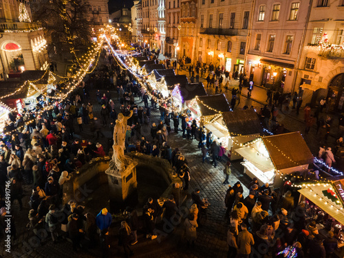 Lviv, Ukraine - January 3, 2021: aerial view of christmas city center with crowd of people