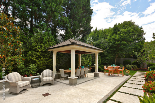 Backyard garden gazebo, tables, and chairs