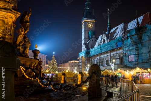 Olomouc Czech Rep 7th December Chrismas market with punch stands and the city hall with astronomical clock being repaired