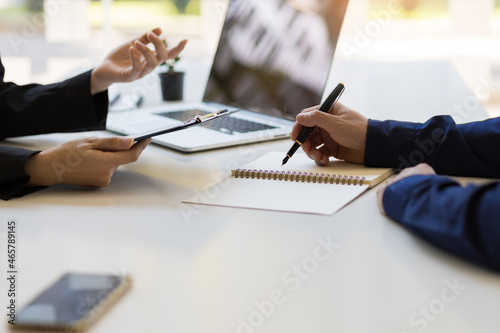 Businessman or insurance agent discussing with customers.