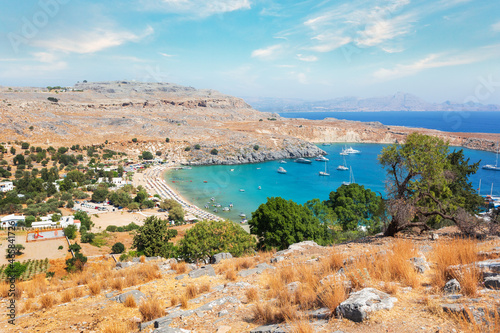 View from the hill of the Acropolis on the Mediterranean coast in the city of Lindos, Rhodes island, Greece