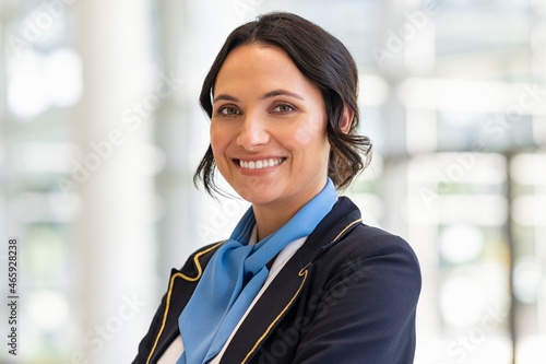 Happy smiling flight attendant at airport