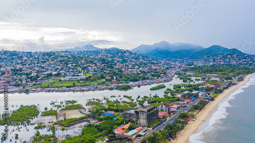 The country Sierra Leone is in West Africa, and benefits from a tropical Atlantic coastline. Its bordered by Guinea and Liberia. The Capital is Freetown, and you can head to the beach in Sierra Leone.