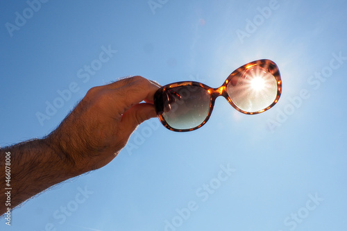 sunglasses on a blue sky
