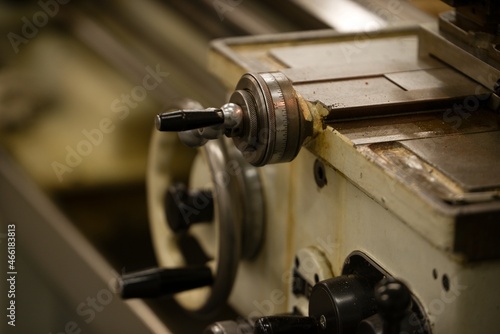 Old metal lathe machine, retro machine background.