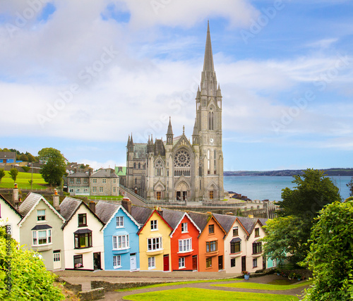 Medieval street, towering Colman's Cathedral in background in the port town of Cobh, County Cork, Ireland