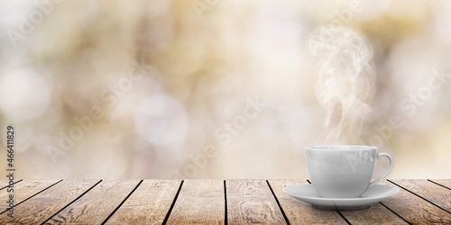 a hot coffee on the table on a spring background