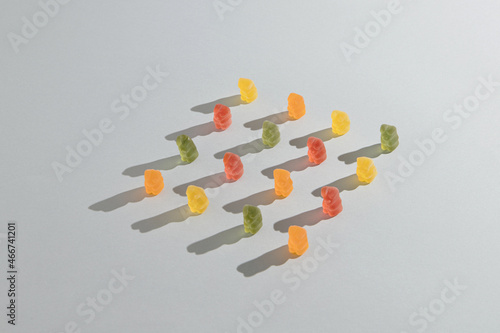 Gummy bears neatly arranged against grey background.Retro style like a 60`, 70`