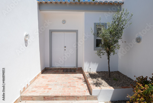 White front door and entrance to portuguese villa