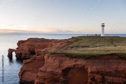 The 1874 Borgot lighthouse located on immense red sandstone cliffs at Cap Hérissé during a fall sunset, Cap-aux-Meules, Magdalen Islands, Quebec, Canada