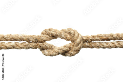Hemp ropes with square knot on white background, closeup