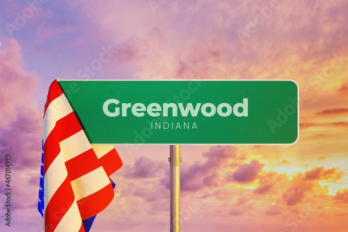 Greenwood - Indiana/USA. Road or City Sign. Flag of the united states. Sunset Sky.