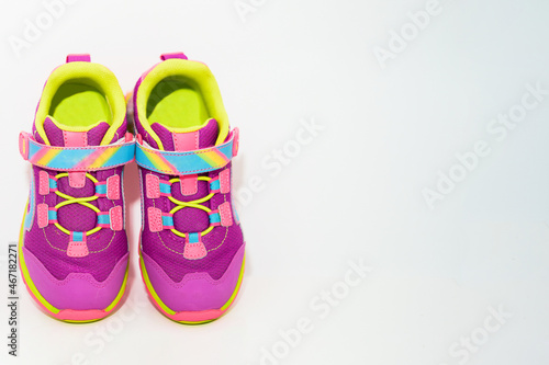color kid sneakers shoes on floor top view soft focus copy space