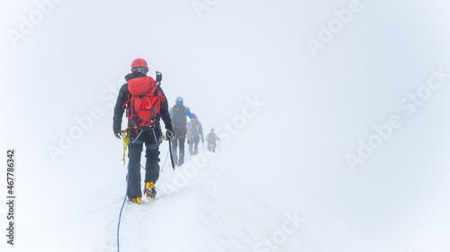 Group of glacier mountaineers on a rope