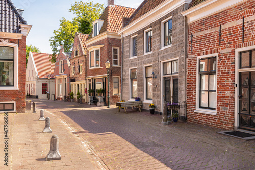 Narrow street with old houses in the picturesque town of Appingedam in the province of Groningen; Netherlands.