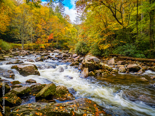 Fall color around small waterfals in the Cullasaja River in Nantahala National Forest between Franklin and Highlands North Carolina USA