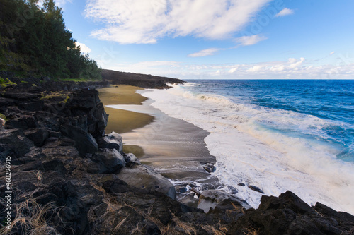Wild beach with volcanic rocks at Reunion Island