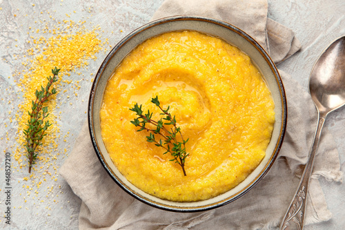 Corn polenta on gray background.