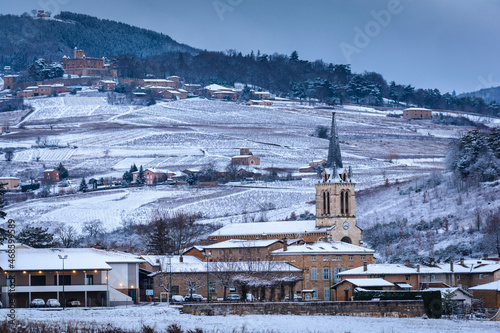 Village of Denice and landscape of Beaujolais under the snow