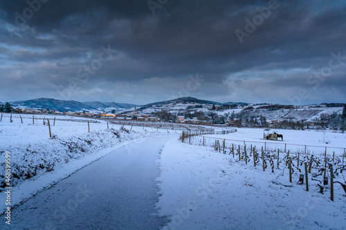 Village of Denice and landscape of Beaujolais under the snow