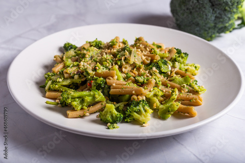 Vegan wholemeal pasta with broccoli and chopped hazelnuts.CR2
