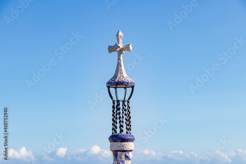 Cross in the entrance of The famous Parc Güell designed by the architect Gaudí in the city of Barcelona.