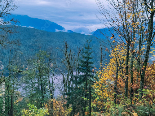 Burrard Inlet, BC, and North Shore mountains, seen from TransCanada Trail at Burnaby Mountain in Fall.