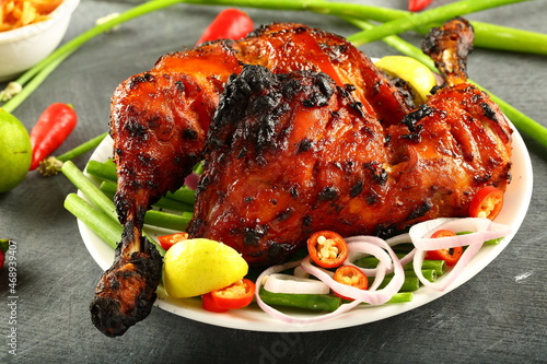 Homemade Indian tandoor cooking- tandoori chicken with vegetable salads. 