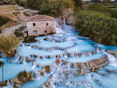 Toscane Italy, natural spa with waterfalls and hot springs at Saturnia thermal baths, Grosseto, Tuscany, Italy aerial view on the Natural thermal waterfalls couple at vacation at Saturnia Toscany