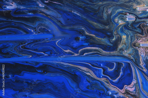 art photography of abstract marbleized effect background with black and blue creative colors. Beautiful paint.