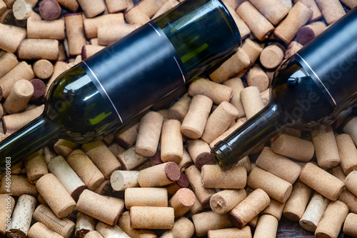 Wine bottle standing on wine corks. top view