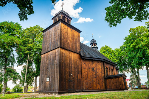 Lubowo, Poland - August 09, 2021. Old wooden st. Mikolaj Church - Kosciol pw. sw. Mikolaja