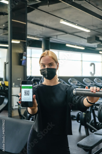 Fitness,sports.fit,Girl in mask fitness gym opening lockdown covid passport,QR cod Wellness, health care,generation z sports recreation concept online fitness apps. workout,training,Fit wellness