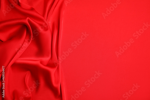 Texture of delicate red silk as background, top view