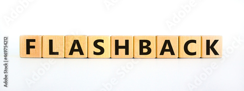 Flashback symbol. The concept word Flashback on wooden cubes. Beautiful white table, white background. Business and flashback concept. Copy space.