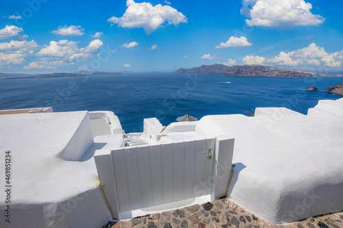 Amazing Santorini landscape with white architecture and sea view. Sunny summer travel background, cityscape, urban scenic. Idyllic streets, pathway, pool and houses. Luxury resort hotel vacation