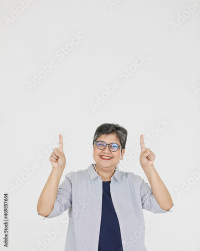 Merry Asian woman pointing away