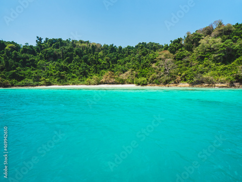 Ko Rang Island. Peaceful white sand beach, clear turquoise seawater against summer blue sky. Mu Koh Chang National Park, Trat, Thailand.