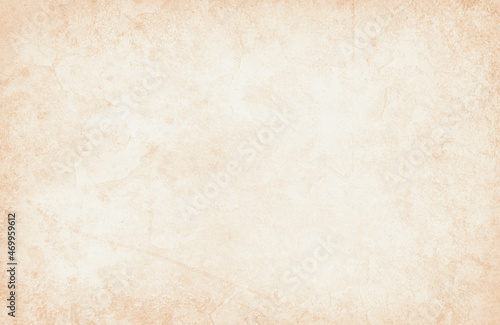 Old brown paper parchment background with distressed vintage stains and ink border and white faded shabby center, elegant antique beige color with coffee or tea stained border
