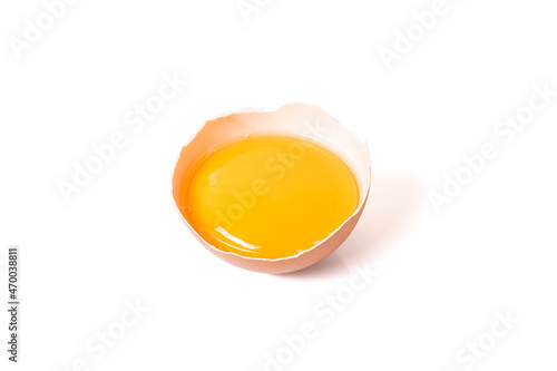 half broken egg and yolk isolated on white background with clipping path.