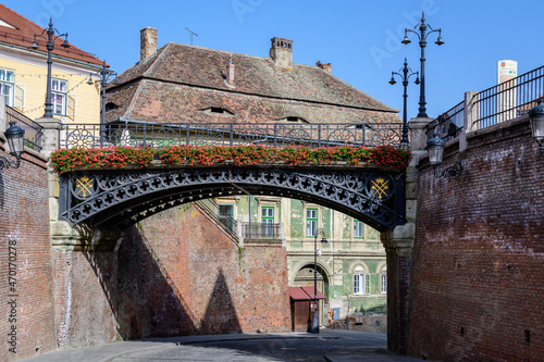 The Bridge of Lies (Podul Minciunilor) near the Small Square (Piata Mica) in the historical center of the Sibiu city in Transylvania (Transilvania) region of Romania, in a sunny summer day..