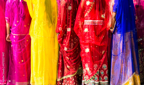 Indian women dressed in traditional colorful sari 
