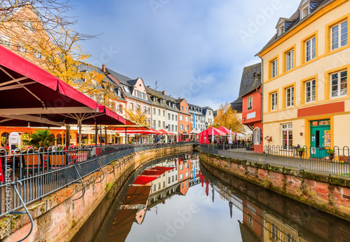 Saarburg, Germany. City center with terraces and coffee shops over the river.