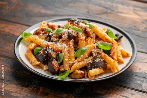 Pasta alla Norma with eggplant or aubergine, tomato, parmesan and basil. Healthy food