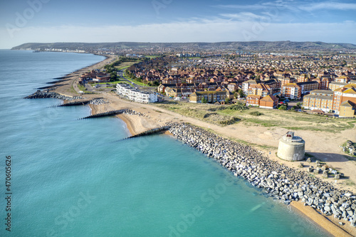 Aerial view along to Langley Point and Eastbourne with a Martello Tower in the foreground.