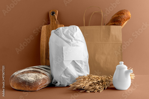 Blank wrapped paper bread with bag, board, bakery branding mockup, empty space to display your logo or design.