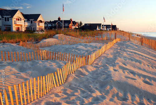 snow fences help prevent erosion of sand dunes that protect summer homes
